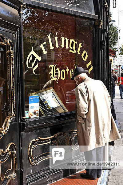Man reading food menu at the Arlington Hotel  Dublin  Ireland  Europe