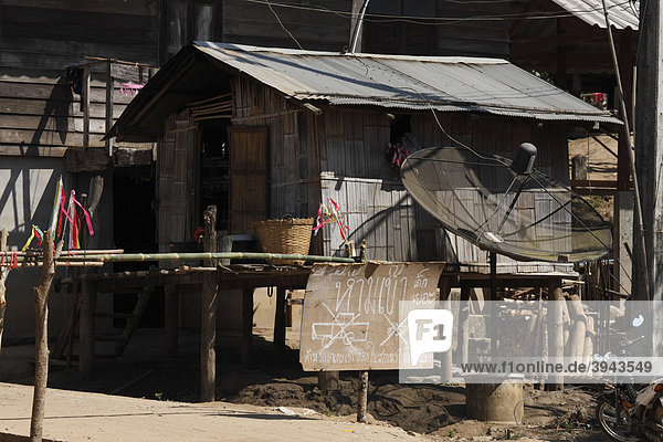 Barrier with hand-painted sign no entry and satellite dish in a village of the Akha hill people  Northern Thailand  Thailand  Asia