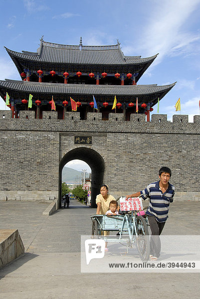 Man with a tricycle  gate of the city wall  West Gate  Dali  Yunnan Province  People's Republic of China  Asia