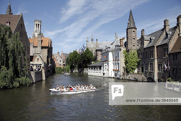 Boat tour through canals  historic center of Bruges  Flanders  Belgium  Europe