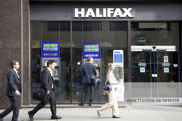 Passers-by at the cash machine of the Halifax Bank in London  England  United Kingdom  Europe