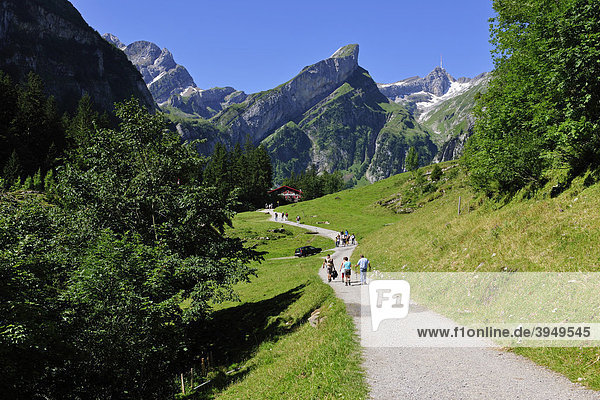 Hikers on the path leading to the Seealpsee Lake  Alpstein Mountains  Canton Appenzell  Switzerland  Europe