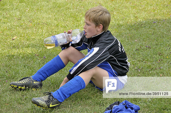 A nine-year-old player of the E-2 junior league waiting for the match to start  children's soccer tournament  Baden-Wuerttemberg  Germany  Europe