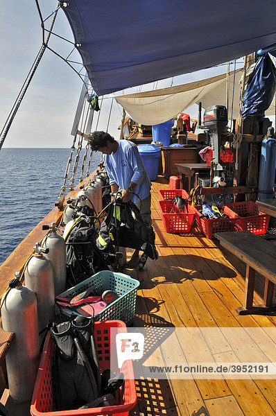 Diving equipment and Divemaster  diving instructor on the MS-Felicia Liveaboard  Flores  Indonesia  Southeast Asia