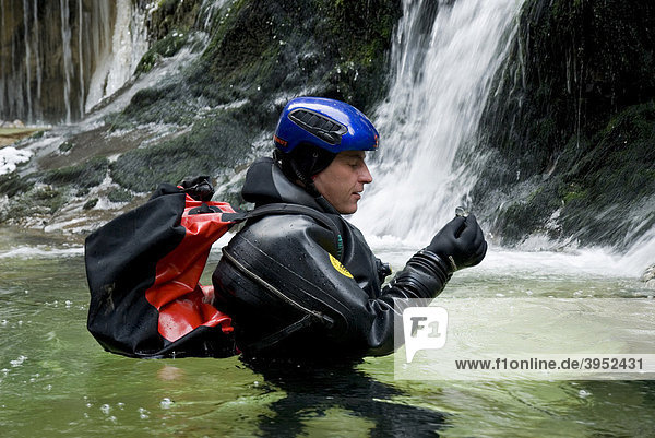 Man canyoning in the Haselschlucht Gorge at the Kalkalpen National Park during winter  Upper Austria