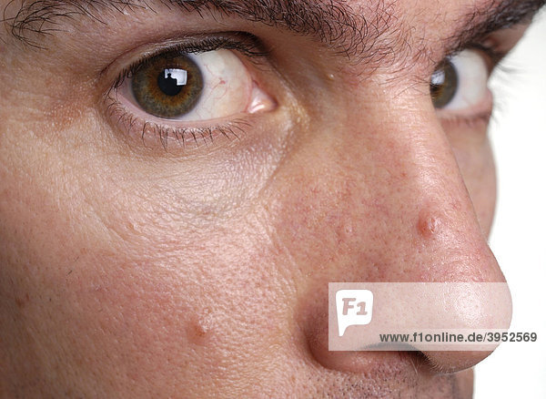 Close-up of man's eyes glancing sideways