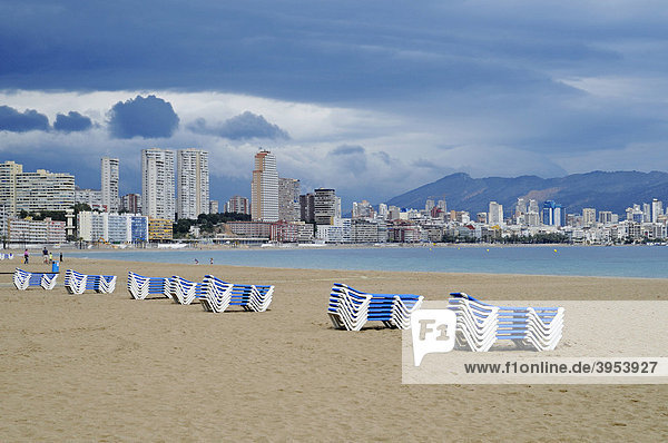 Empty beach deck chairs dark clouds bad weather emergency Playa de Poniente Ponent beach Benidorm Costa Blanca Alicante Spain Europe