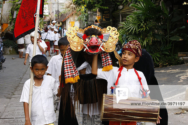 Three boys with Barong costumes during a procession  Ubud  Bali  Republic of Indonesia  Southeast Asia