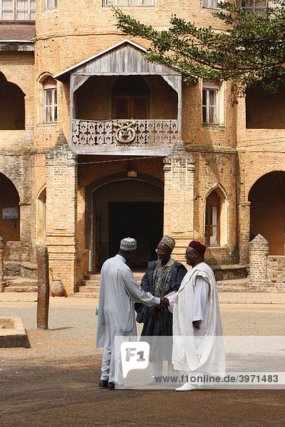 Before the Sultan's palace  men are awaiting an audience with the Sultan  Foumban  Cameroon  Africa