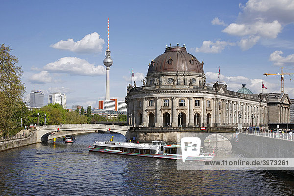 Boat on Spree River in front of Bode Museum on Museum Island and Television Tower  Berlin  Germany  Europe