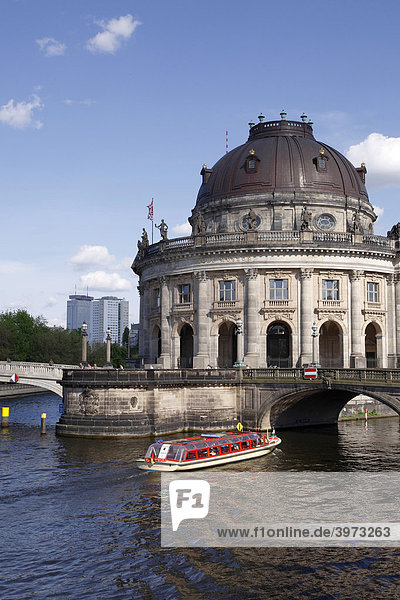 Boat on Spree River in front of Bode Museum on Museum Island Berlin Germany Europe