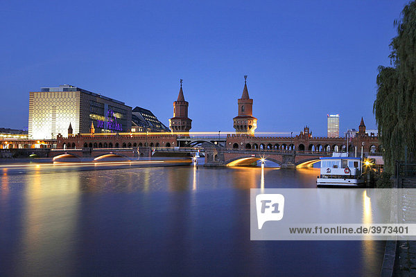 Oberbaumbruecke bridge across the Spree river in the evening in Berlin Germany Europe