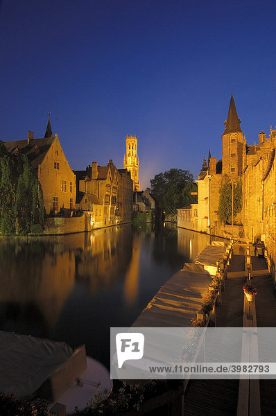 Belfry and River Dijver at dusk Bruges Flanders Belgium Europe