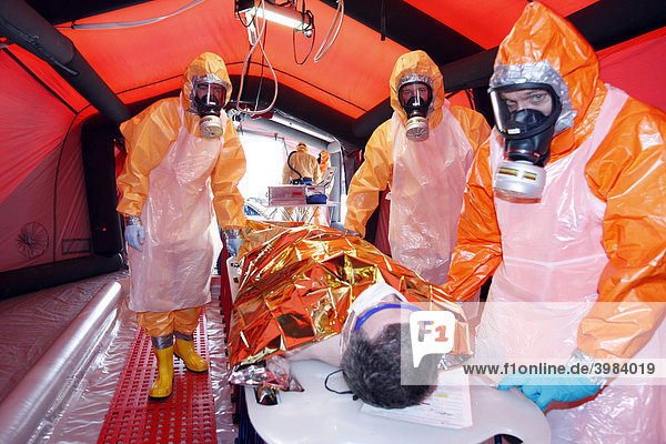 Decontamination  detoxication  of contaminated people after chemical spills or biological contamination  in a decontamination tent from the emergency services of the Main-Taunus-Kreis district  Muenster  North Rhine-Westphalia  Germany  Europe