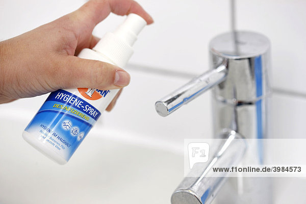 Hand basin being disinfected with a disinfectant
