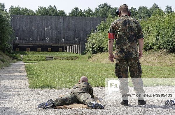 Soldiers shooting during a shooting competition at a shooting range  13th International Paratrooper Competition of the Special Operations Division  Hoehenhof near Regensburg  Bavaria  Germany  Europe