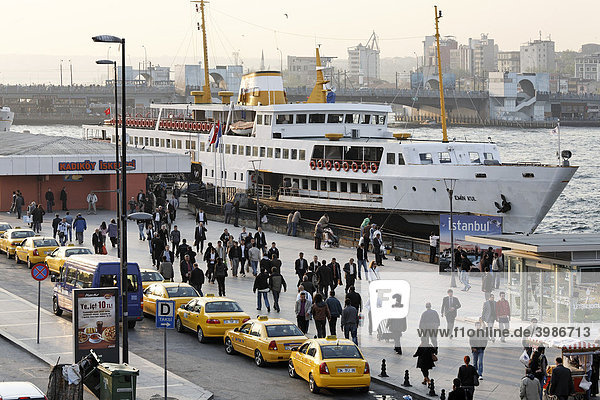 Ferry terminal Eminoenue  taxi queue  crowded with people  Istanbul  Turkey