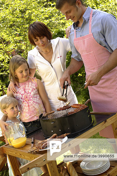 Family having a barbecue in the garden