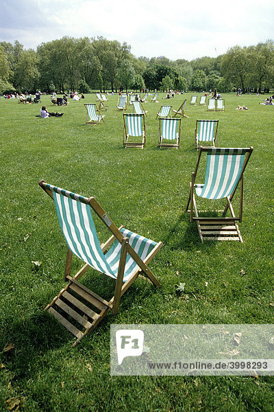 Deck chairs on the grass in Green Park  Ritz Corner  London  England  UK  Europe