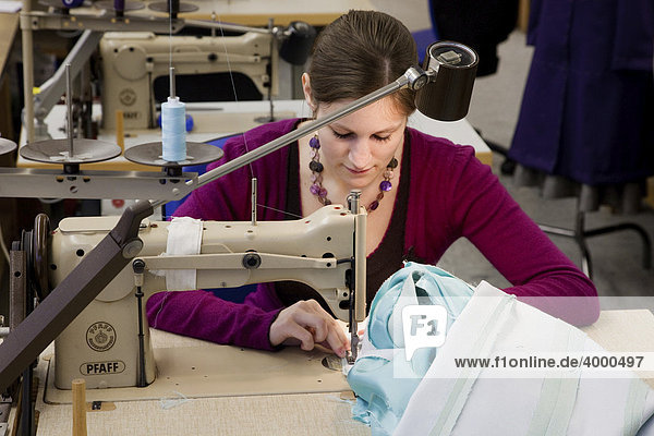 Seamstress using a sewing machine in the Master Craftspeople School of the Chamber of Small Industries and Skilled Trades for ladies's and men's tailoring  Duesseldorf  North Rhine-Westphalia  Germany  Europe