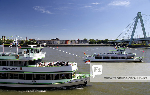 Excursion boats on the Rhine river in front of the Severinsbruecke bridge  Cologne  Rhineland  North Rhine-Westphalia  Germany  Europe