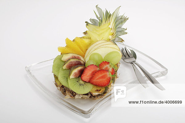 Colourful fruit salad in a baby pineapple