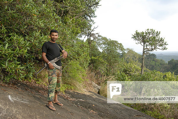 Rifle-armed fighter in the mountains  near the Mulgirigala Temple  Mulkirigala Vihara  Ceylon  Sri Lanka  South Asia  Asia