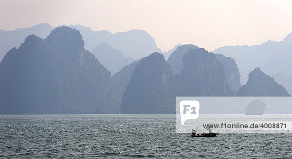 Rock formations with a rowboat  Halong Bay  Hanoi  Southeast Asia