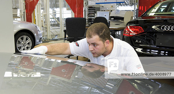 An Audi employee is checking an Audi A4 sedan for possible faults at the control centre of the Audi plant in Neckarsulm  Baden-Wuerttemberg  Germany  Europe