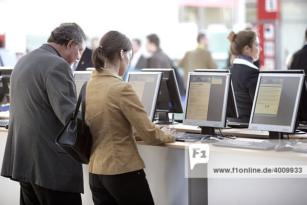 Visitors registering at the online registration site at the computer and IT fair Systems in Munich  Bavaria  Germany  Europe
