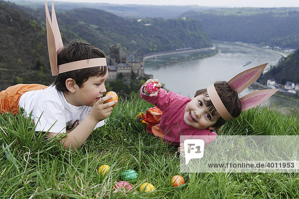 Children looking for Easter eggs at the Rhine River above the Loreley rock  Patersberg  Rhineland-Palatinate  Germany  Europe