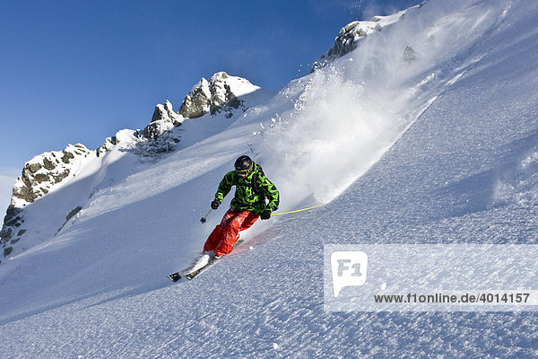 Freestyle skier skiing downhill in an open terrain  Pass Turn  Kitzbuehl Alps  North Tyrol  Austria  Europe