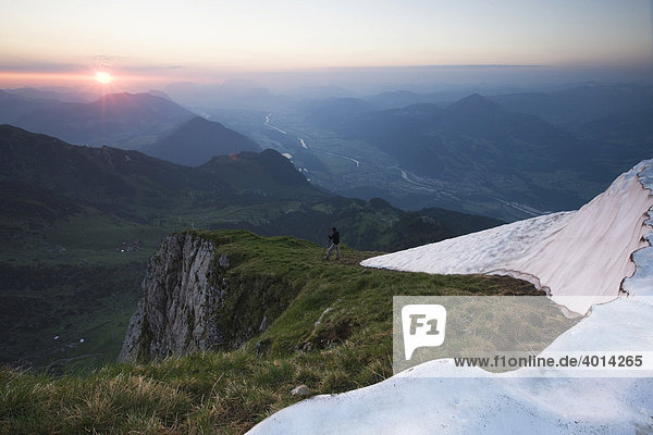 Hiker walking down to the valley at sunset  Rofan Range  North Tyrol  Austria  Europe