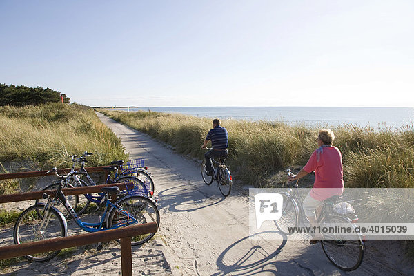 Two cyclists near Vitt  elderly people  riding a bike  Hiddensee Island  Mecklenburg-Western Pomerania  Germany