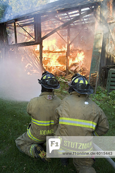Members of the Shipshewana Volunteer Fire Department at a barn fire  Shipshewana  Indiana  USA