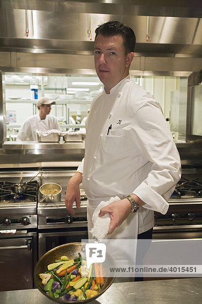 A chef preparing a dish at the Wolfgang Puck Grille in the MGM Grand casino  Detroit  Michigan  USA