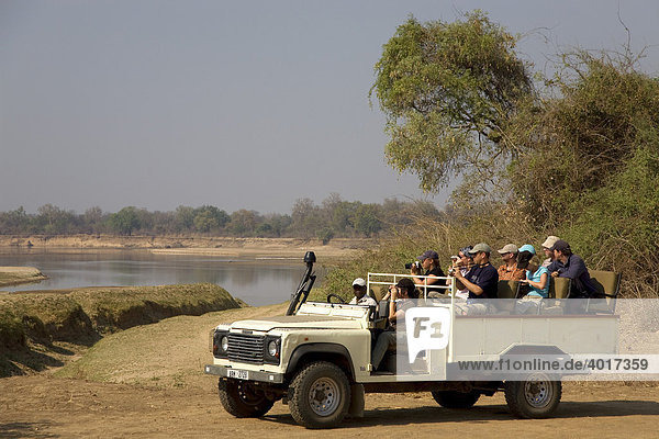 Safari trip  Game Drive  tourists in the South Luangwa National Park near Mfue  Eastern Province  Republic of Zambia  Africa