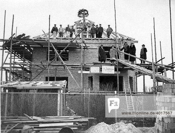 Construction workers  topping-out ceremony  historical image  ca. 1930