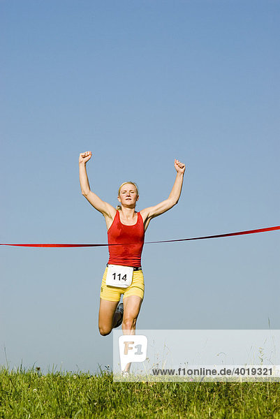 Woman crossing the finish line