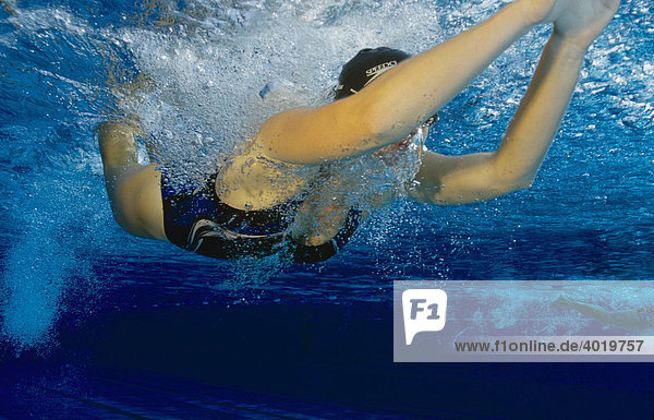 Female swimmer  20 year-old  training the butterfly style in a pool in Steyr  Upper Austria  Europe