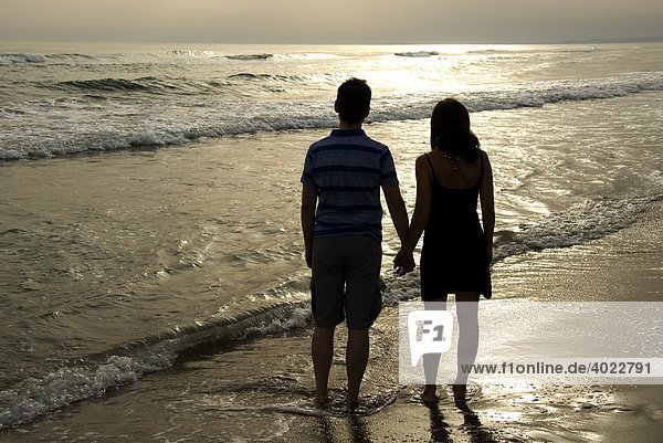 Couple on the beach  silhouettes  sea  Camargue  France  Europe