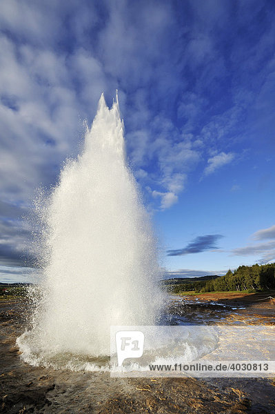 Geyser Strokkur eruption of fountains  ejected water spouts  sequence of 4 shots  geyser  Iceland  Europe