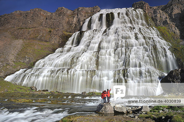 Waterfall Dynjandi rather Fjallfoss  hiker  West Fjord  Iceland  Europe