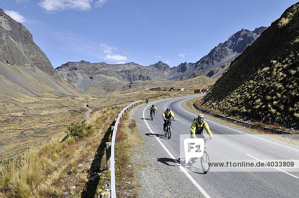 Mountainbikers descending a street  Downhill Biking  Deathroad  Altiplano  La Paz  Bolivia  South America