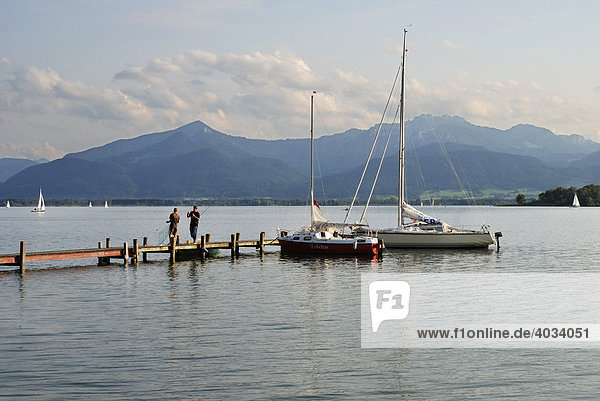 Jetty with sailing boats  Fraueninsel on Chiemsee  Chiemgau  Upper Bavaria  Bavaria  Germany  Europe