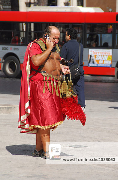 Roman in masquerade on his mobile phone  Rome  Italy  Europe