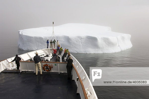 Cruise ship approaching an iceberg  Monumental Island  Davis Strait  Nunavut  Canada  North America