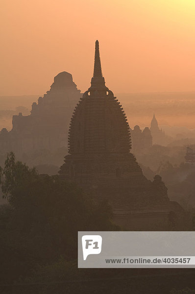 Temples and pagodas in early morning fog  Bagan  Burma  Myanmar  Southeast Asia