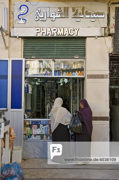 Women in front of a pharmacy  Aswan  Egypt  Africa