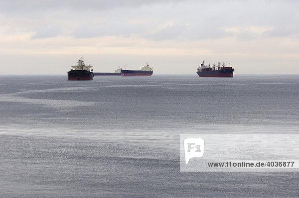 Large cargo vessels anchored in English Bay waiting to dock at the port of Vancouver  Vancouver  British Columbia  Canada  North America